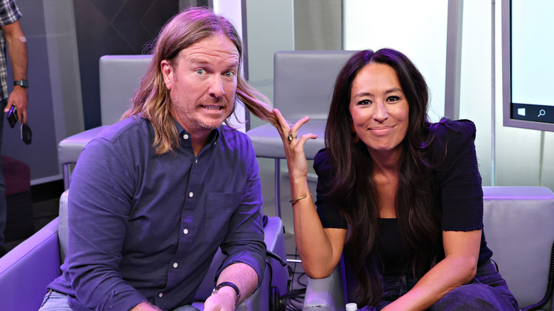 Joanna Gaines playing with Chip Gaines' hair