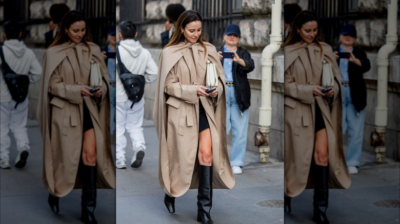 woman wearing cape trenchcoat