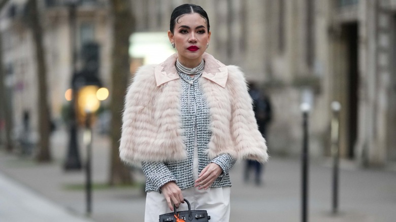 woman wearing caped shawl