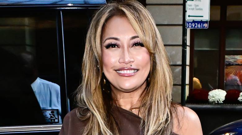 Carrie Ann Inaba smiles on the street in New York