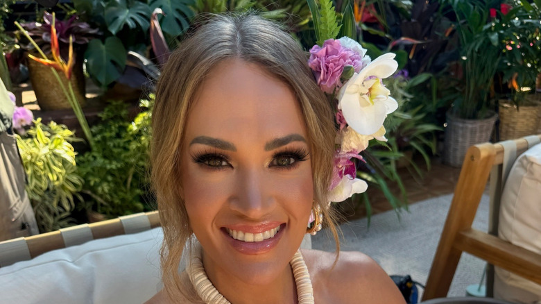 Carrie Underwood with a flower in her hair