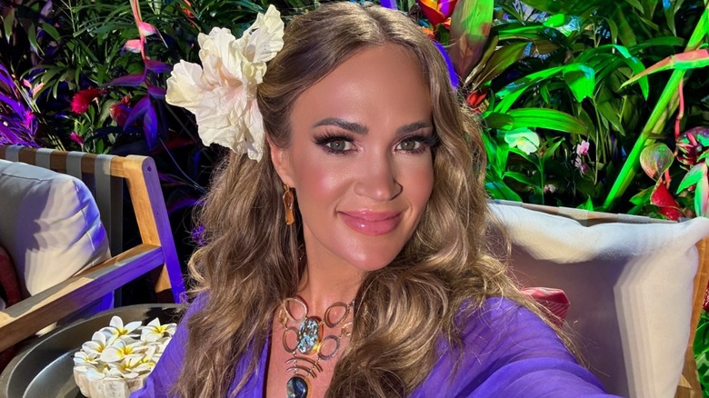 Carrie Underwood wearing a purple dress