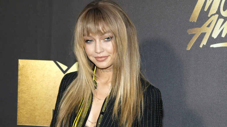 Gigi Hadid appearing at the MTV Movie Awards with a wig that has bangs