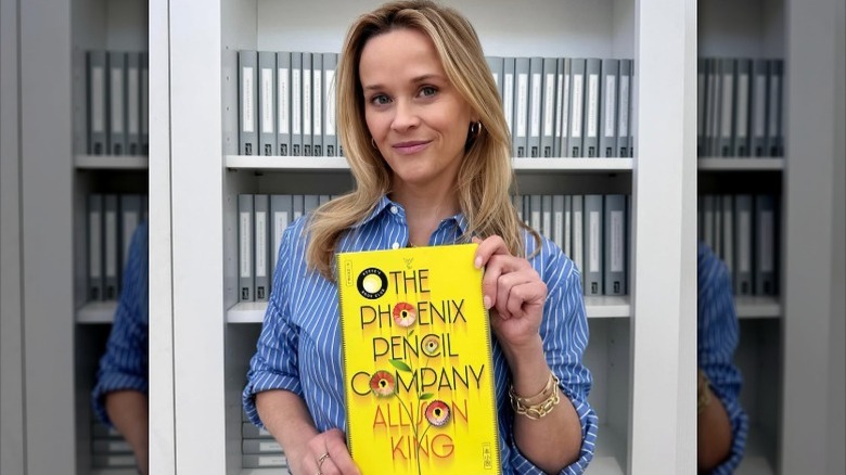 Reese Witherspoon holds the book The Phoenix Pencil Company