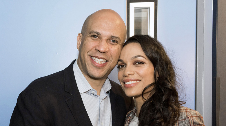 Cory Booker puts his arm around Rosario Dawson