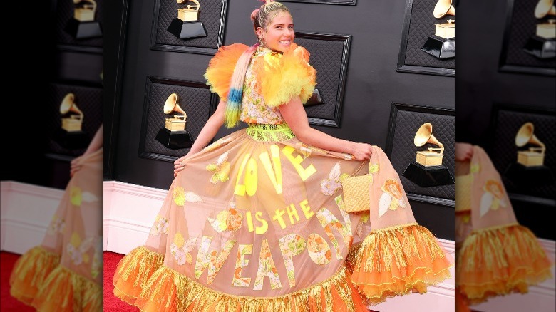 Victoria Evigan posing with orange dress