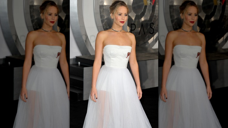 Jennifer Lawrence posing in a white dress