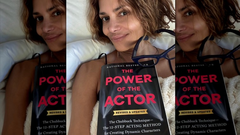 Halle Berry posts a selfie makeup-free and with a book in bed