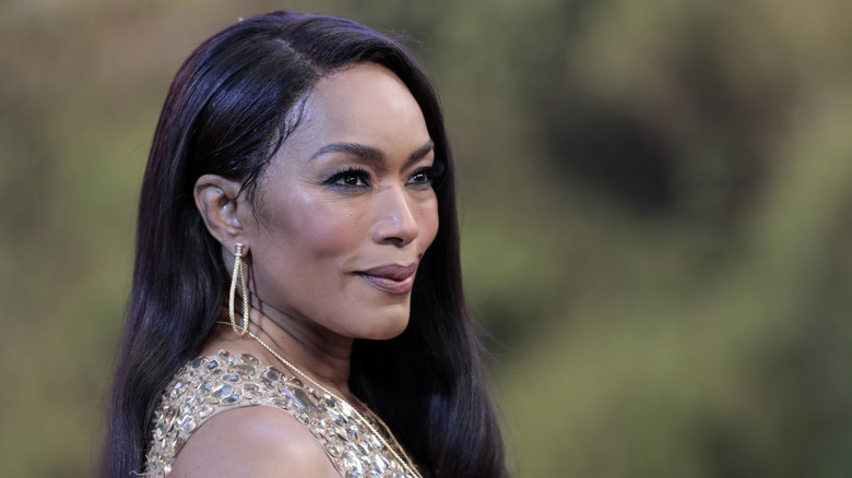 Angela Bassett at an industry event with earthy makeup.