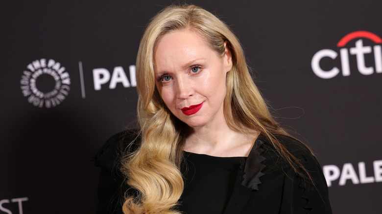 Gwendoline Christie at a red carpet event with red lips.