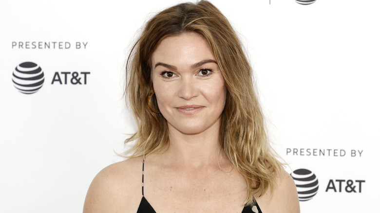 Julia Stiles at a red carpet event with a polka-dot dress.