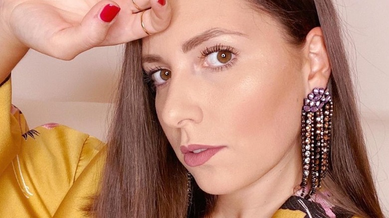 woman in chandelier earrings