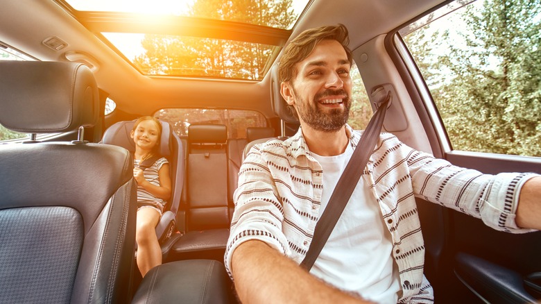 Happy dad driving child 
