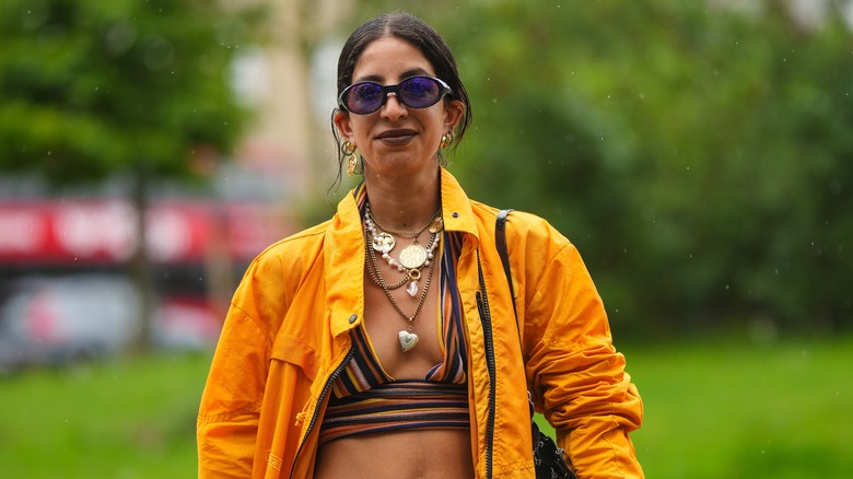 woman wearing multiple necklaces