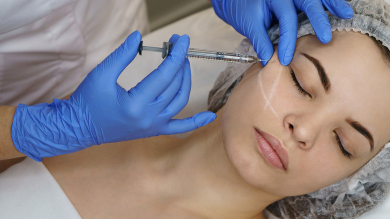 Closeup of cheek filler injection 