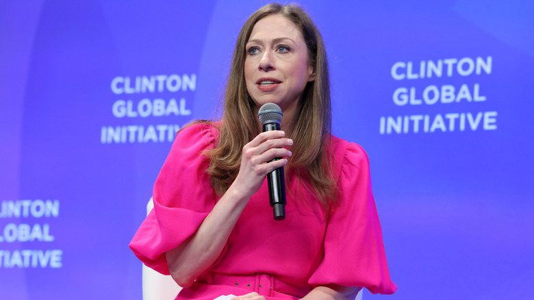 Chelsea Clinton talking into a microphone
