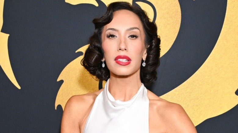 Cheryl Burke poses on the red carpet