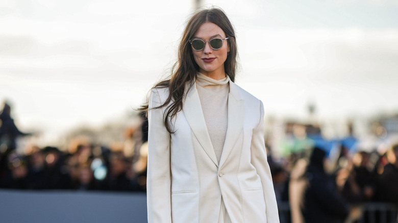 woman in neutral blazer and turtleneck