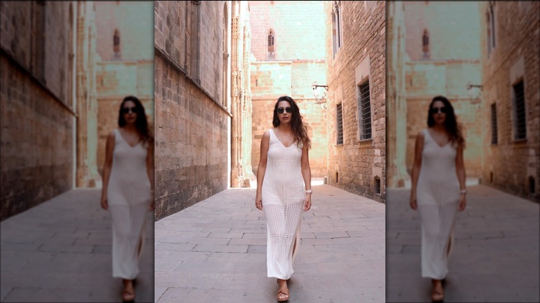 Woman wearing white crochet maxi