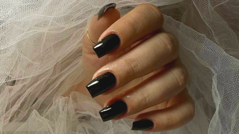 finger nail with black polish