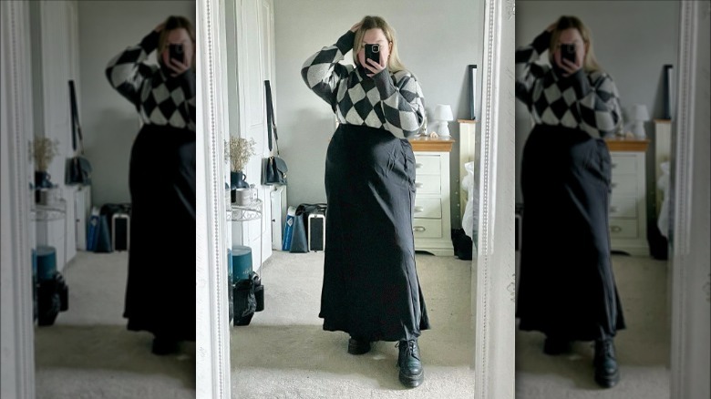 woman wearing chunky boots with a maxi skirt