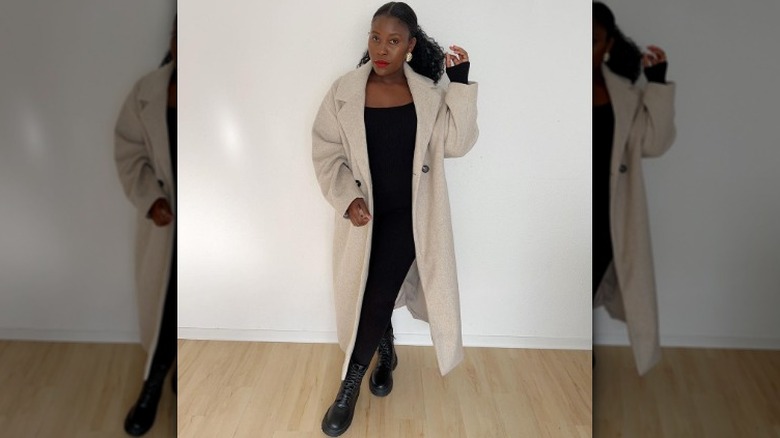 woman wearing chunky boots with a coat