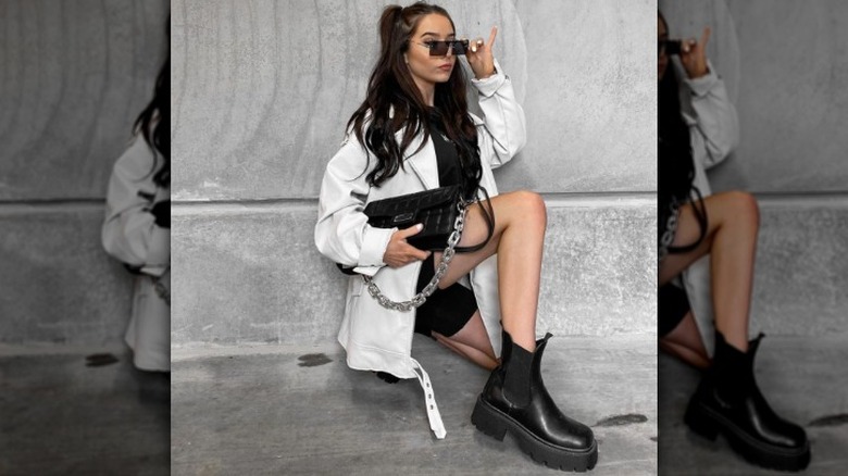 woman wearing chunky boots with bike shorts