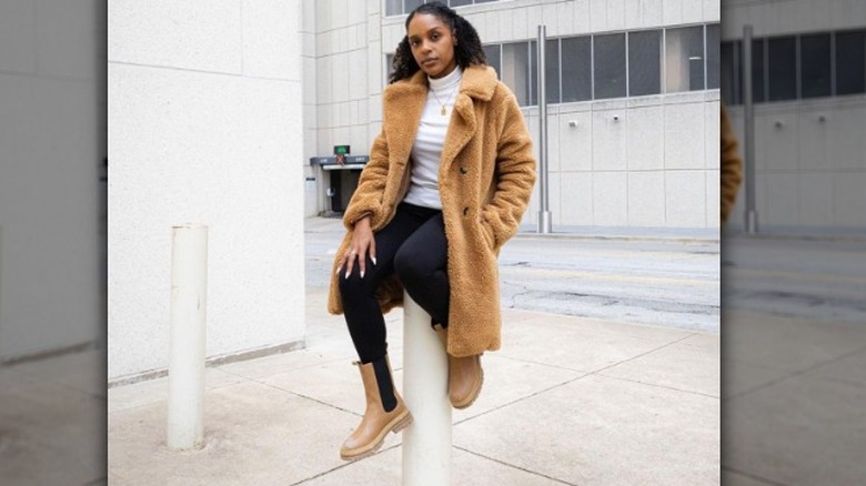 woman wearing chunky boots with teddy coat