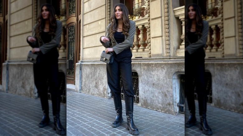 woman wearing chunky boots with tucked-in pants