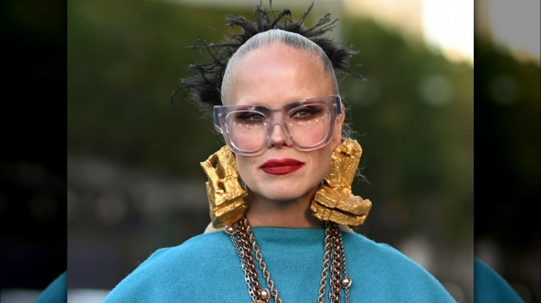 woman wearing large thick earrings