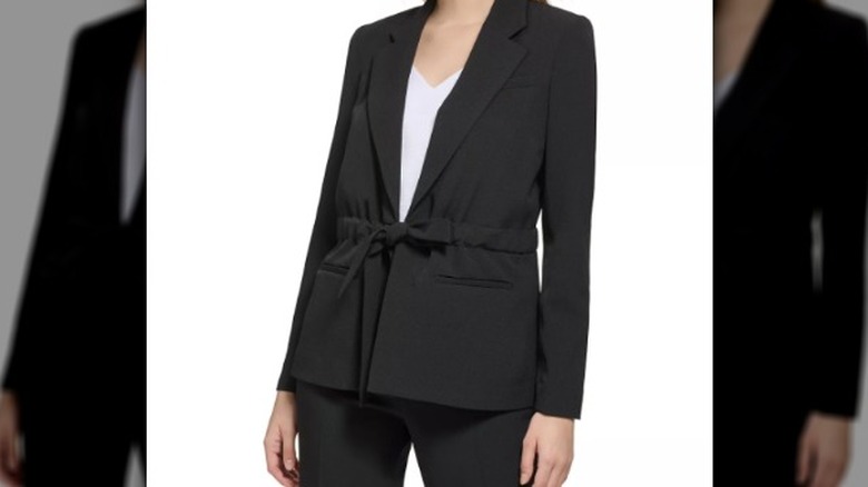 blonde woman black blazer tie