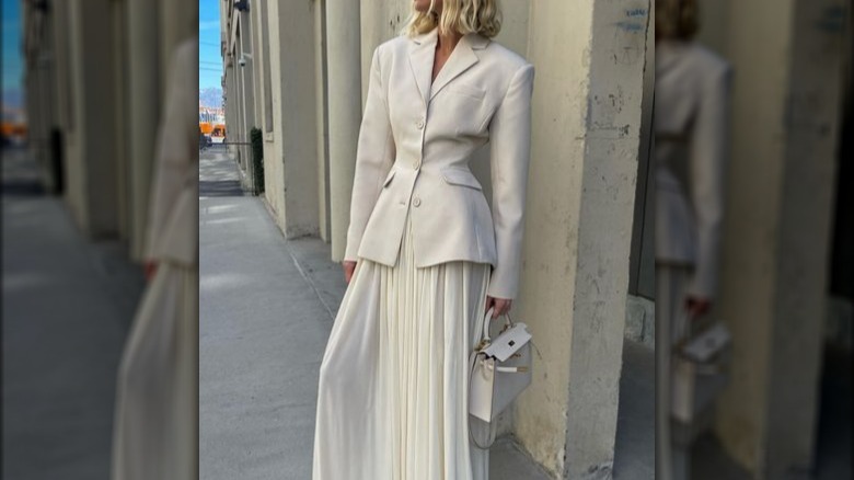 white blazer skirt woman outside