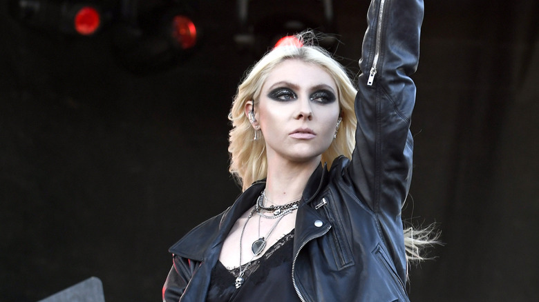 Taylor Momsen performs a song on stage with her band The Pretty Reckless