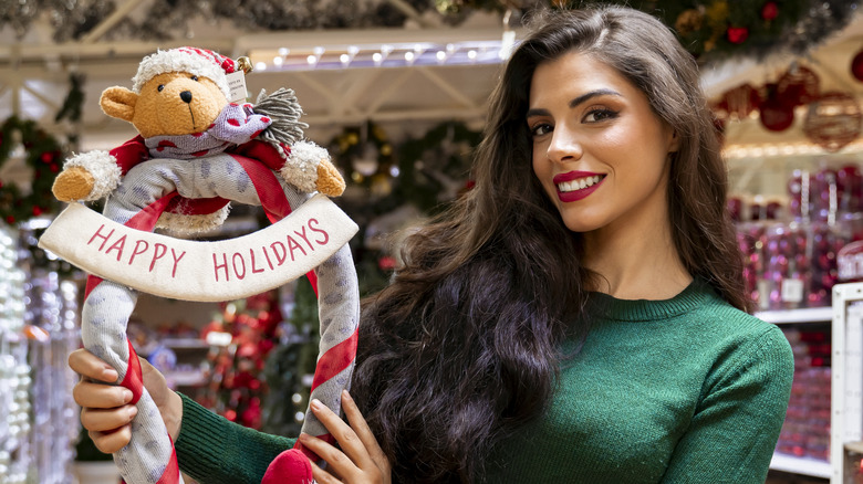 woman with red lipstick and green top