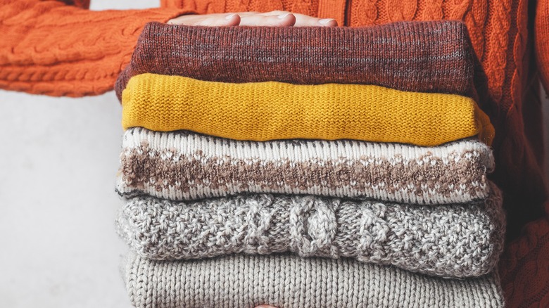 woman packing away clothing