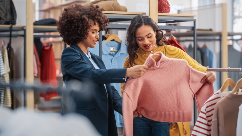 women looking at clothes