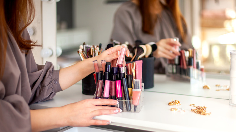 woman choosing lipstick