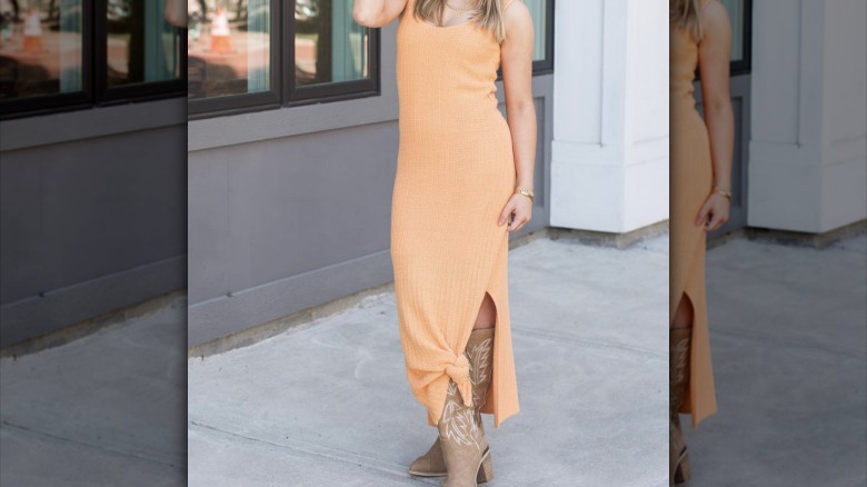 woman wearing orange outfit and boots