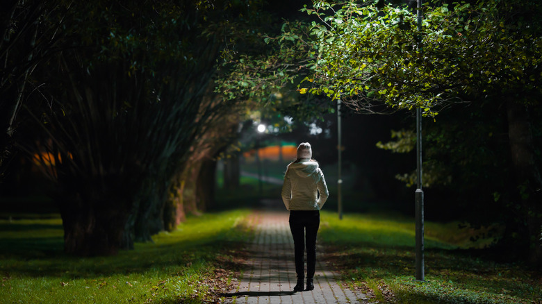 woman walking alone at night