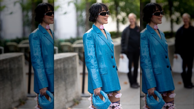 woman wearing blue leather jacket