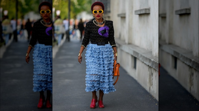 woman wearing red heeled loafers