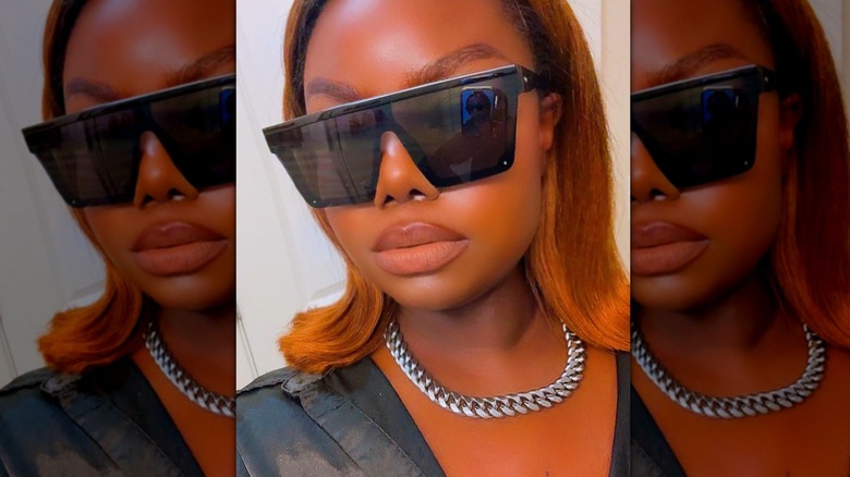 Woman wearing black sunglasses