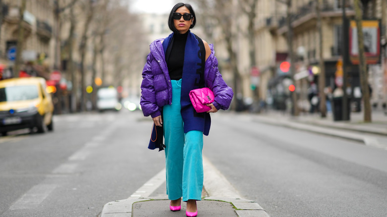 Woman in blue pants, blue jacket