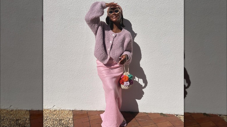 Girl wearing colorful maxi column skirt and sweater.