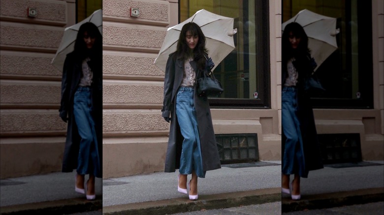 Girl wearing a denim column skirt.