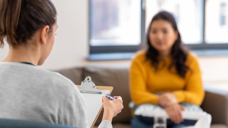 Woman talking to doctor