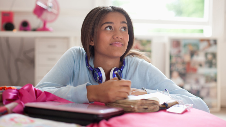 Woman writing in journal
