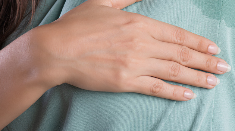 Sweat stain on green shirt