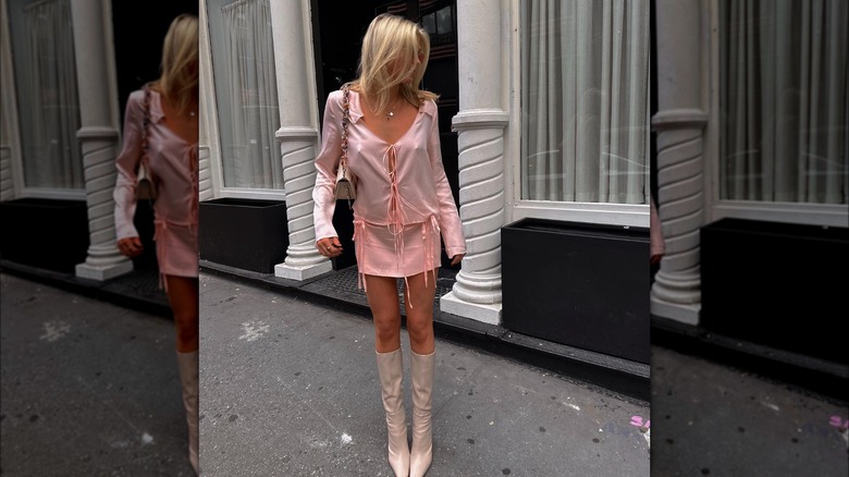 woman in two-piece pink satin set