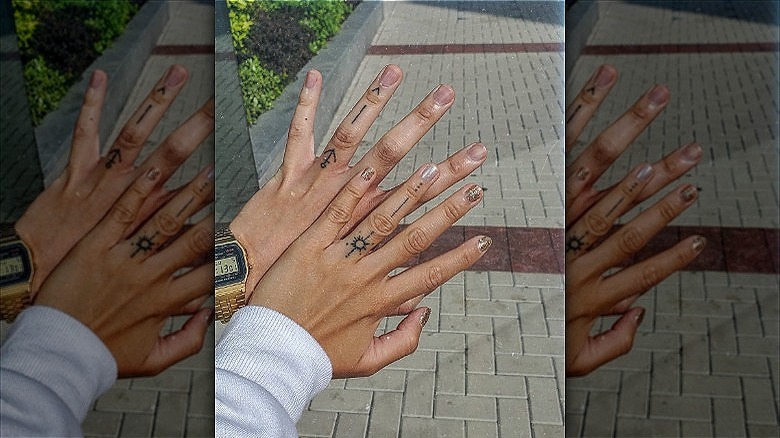 couple with wedding ring tattoos